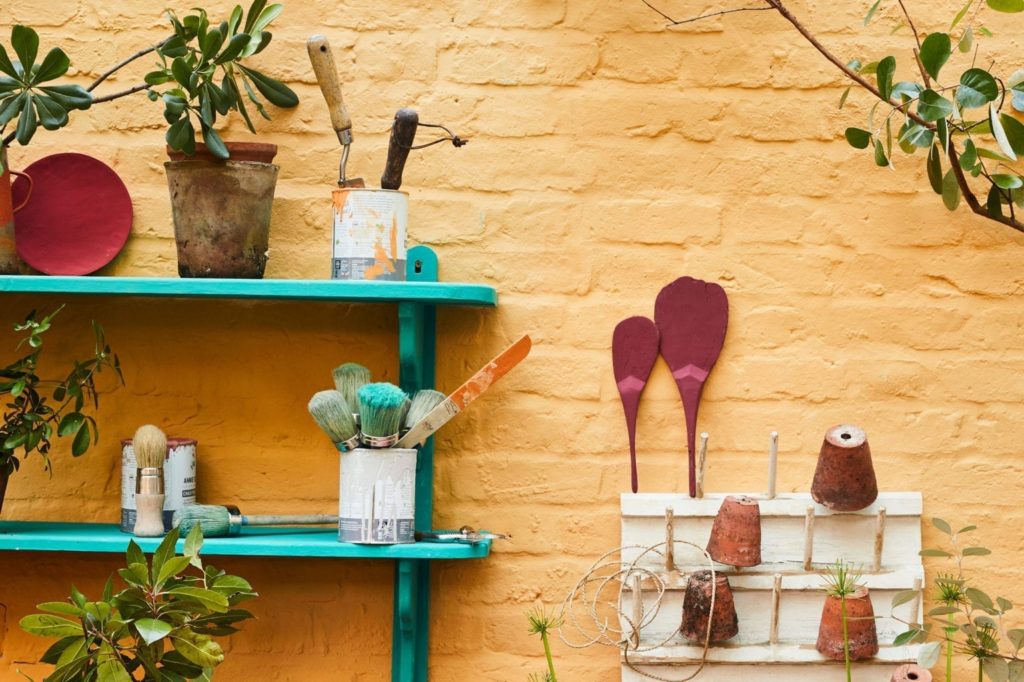 Brick wall painted with Chalk Paint by Annie Sloan in Arles with Provence shelves and Burgundy details