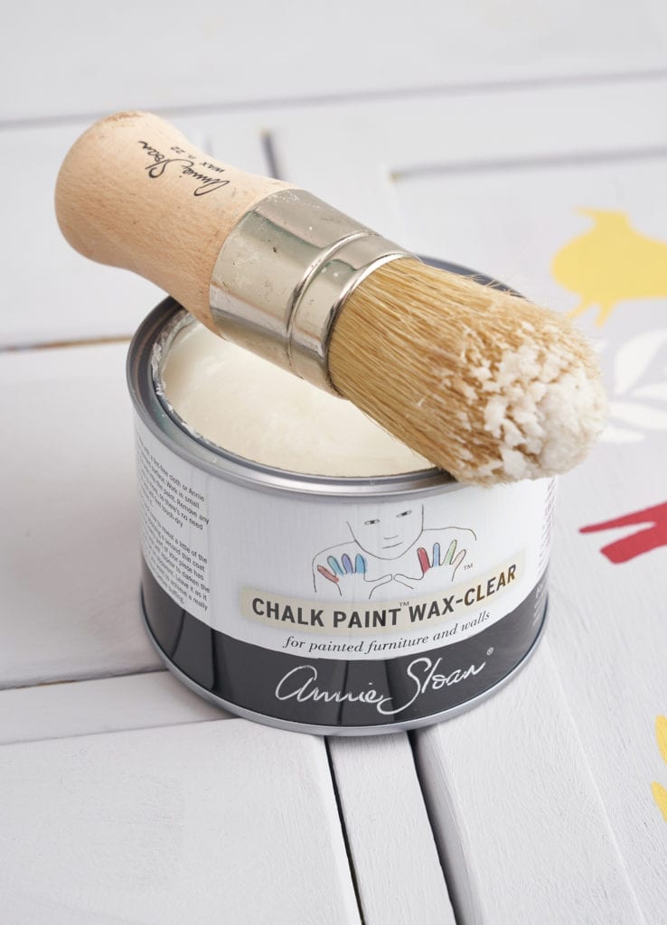 Chalk Paint Wax Brush and 500ml Clear Wax tin on a cupboard painted with Chalk Paint® by Annie Sloan in Chicago Grey