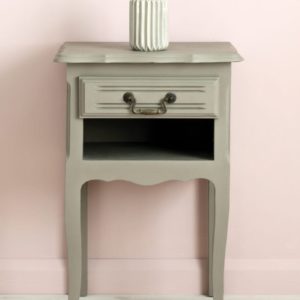 Side table painted with Chalk Paint® in French Linen, cool neutral khaki grey beige against a light pink wall of Antoinette