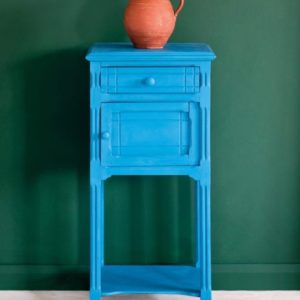 Side table painted with Chalk Paint® in Giverny, a bright, clean, cool blue against a wall of Amsterdam Green