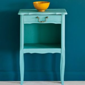 Side table painted with Chalk Paint® in Provence, a light blue-green turquoise against a wall of Aubusson Blue