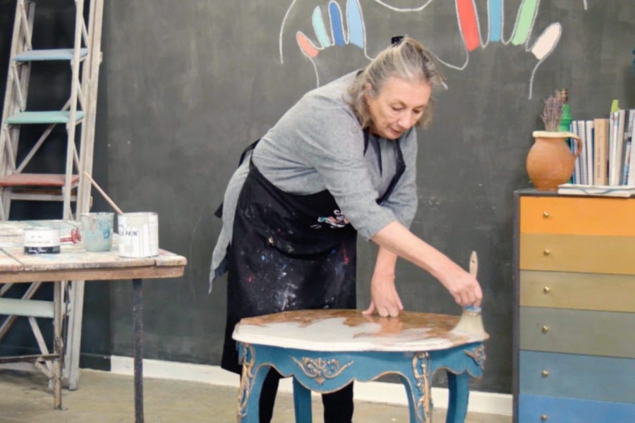 Annie Sloan painting a marble table top with Chalk Paint® furniture paint in Paris Grey