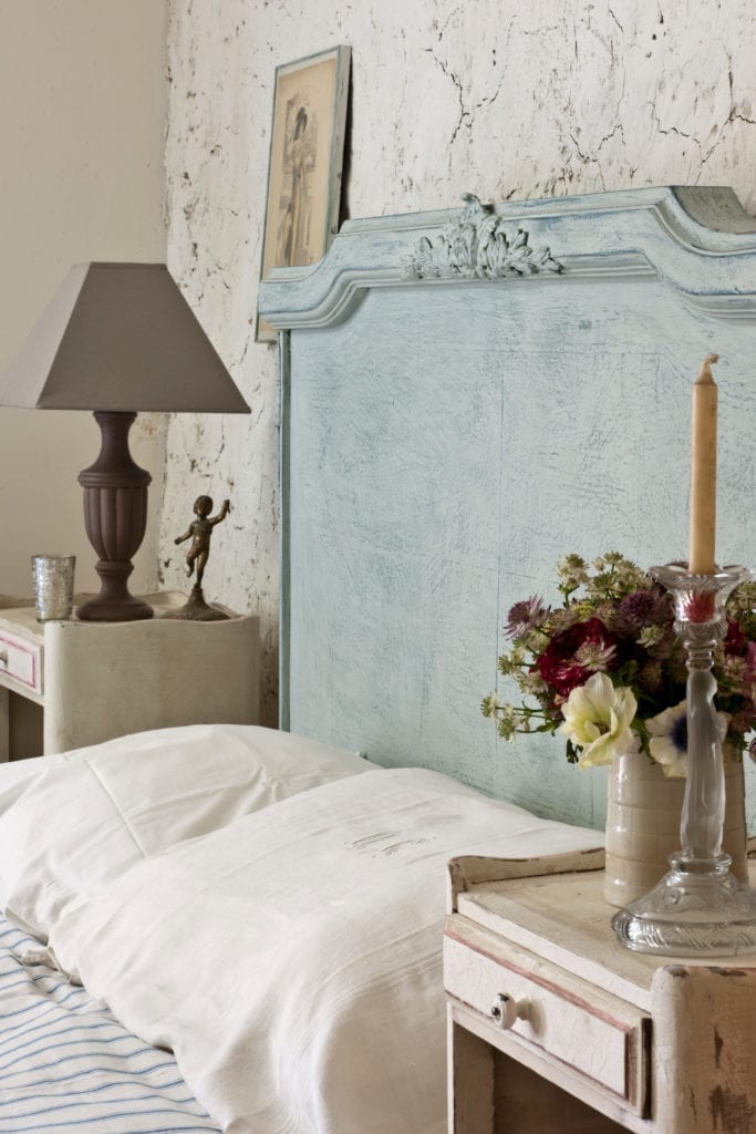 Rustic wax-resist headboard painted with Chalk Paint® by Annie Sloan from her Normandy Farmhouse.