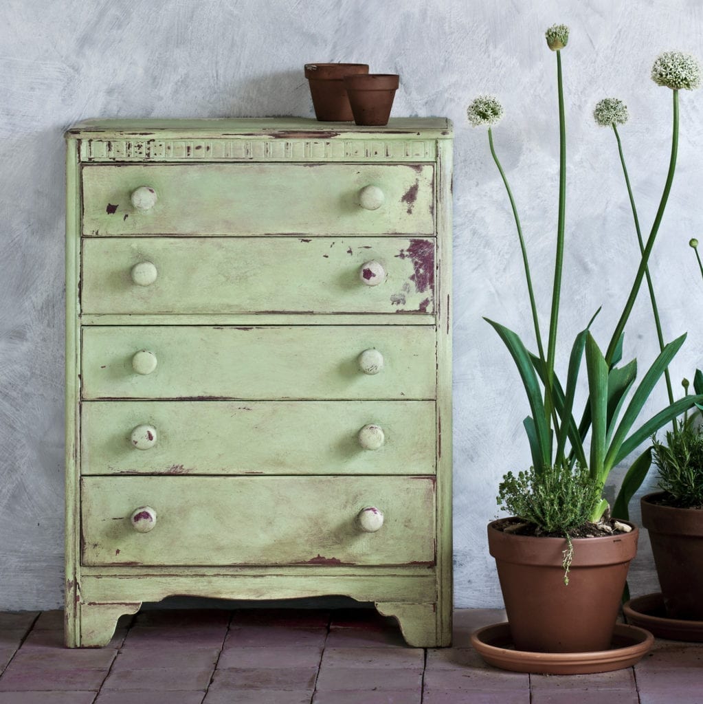 Chest of drawers painted with Chalk Paint® by Annie Sloan in Lem Lem, a soft, warm bright green, and sanded back for a distressed look. With alliums