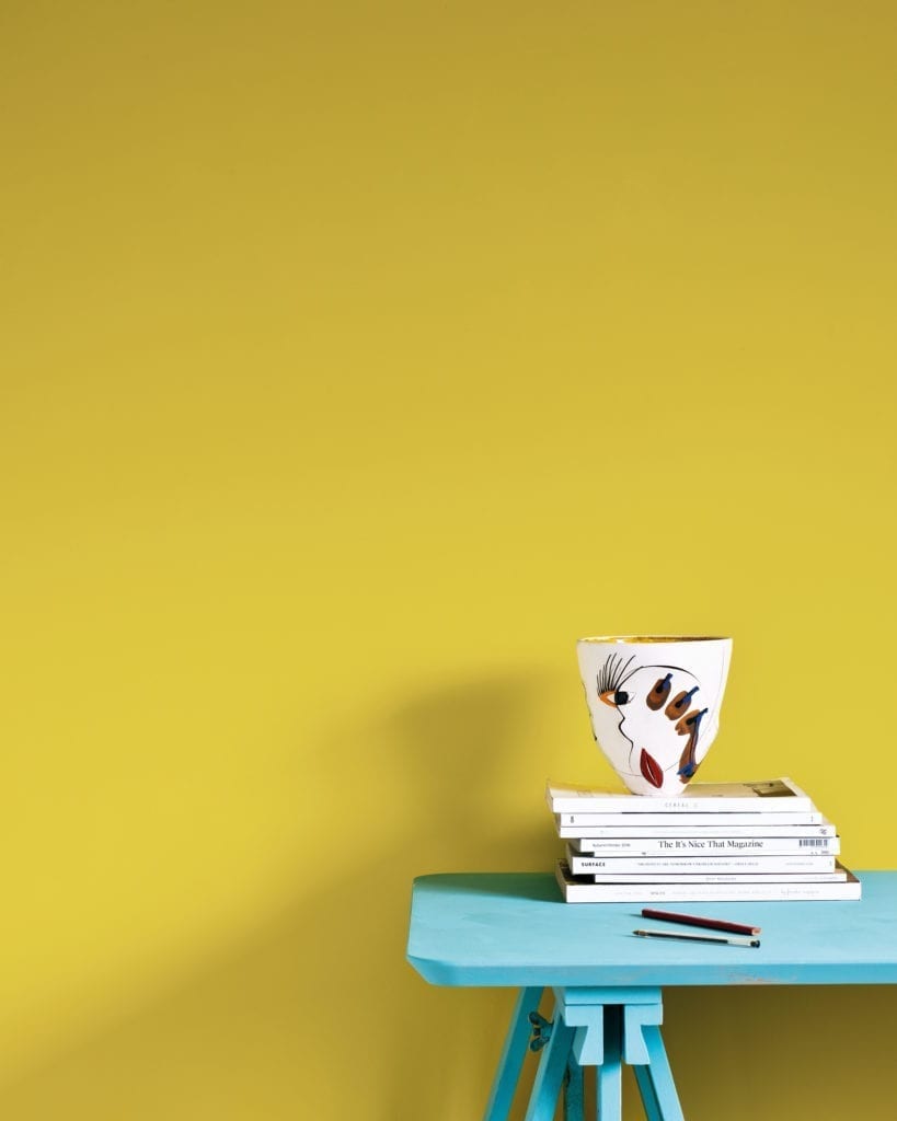 Wall painted with Wall Paint by Annie Sloan in English Yellow, a bright traditional yellow, with Provence desk