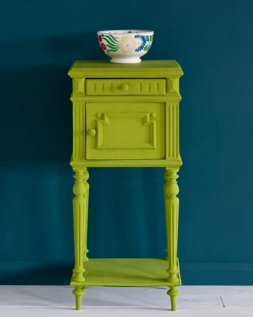 Side table painted with Chalk Paint® in Firle, a fresh, zesty and crisp green made in collaboration with Charleston Farmhouse. Against a wall of Aubusson Blue