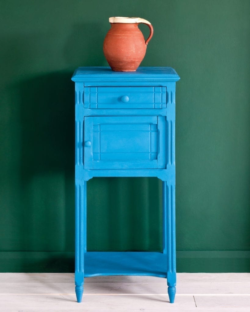 Side table painted with Chalk Paint® in Giverny, a bright, clean, cool blue against a wall of Amsterdam Green