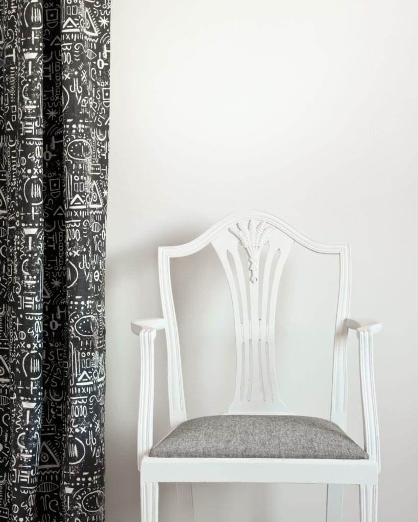 Wall painted in Old White Wall Paint by Annie Sloan, chair painted in Chalk Paint® in Old White, Tacit in Graphite curtain and seat cushion in Linen Union in Old White + French Linen