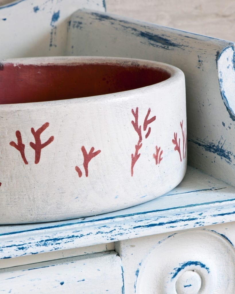 Pot painted with Chalk Paint in Old White and stencilled with Coral Stencil by Annie Sloan in Burgundy