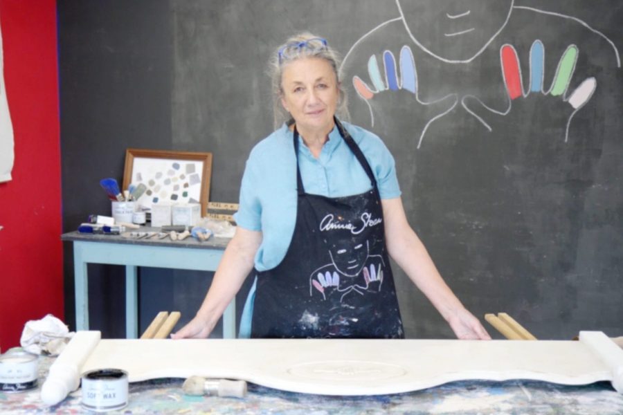 Annie Sloan giving a bedhead an aged distressed look with Dark Chalk Paint® Wax on Chalk Paint® furnitrue paint in Old White