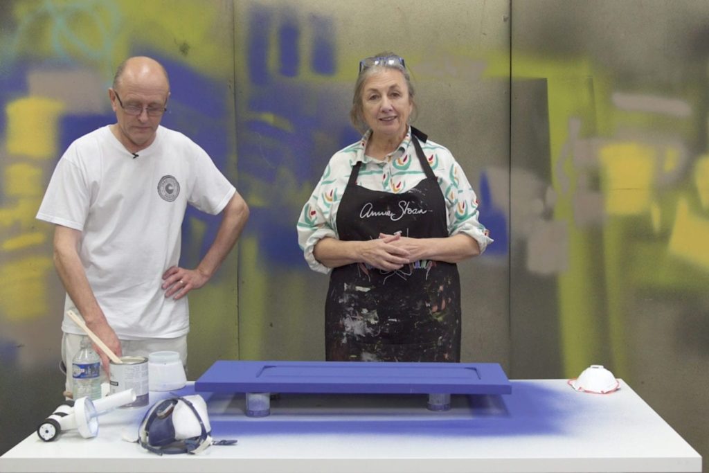 Annie Sloan and Ron Taylor show how to seal a kitchen cabinet using a spray gun with Gloss Chalk Paint® Lacquer