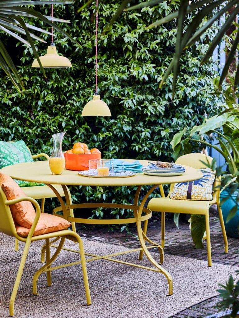 Outdoor dining furniture painted with Chalk Paint® furniture paint by Annie Sloan in English Yellow and Matt Lacquer