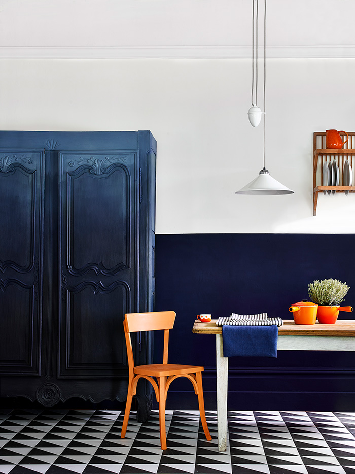 Oxford Navy wall paint used in a kitchen dining area on a half all