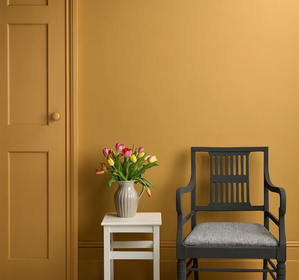 Lifestyle Image of Annie Sloan Satin Paint in Carnaby Yellow used on door and skirting