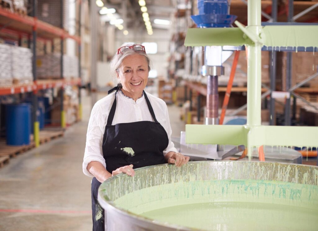 Annie Sloan making Chalk Paint® in Lem Lem in the Oxford factory Credit to Tina Hillier and Oxfam