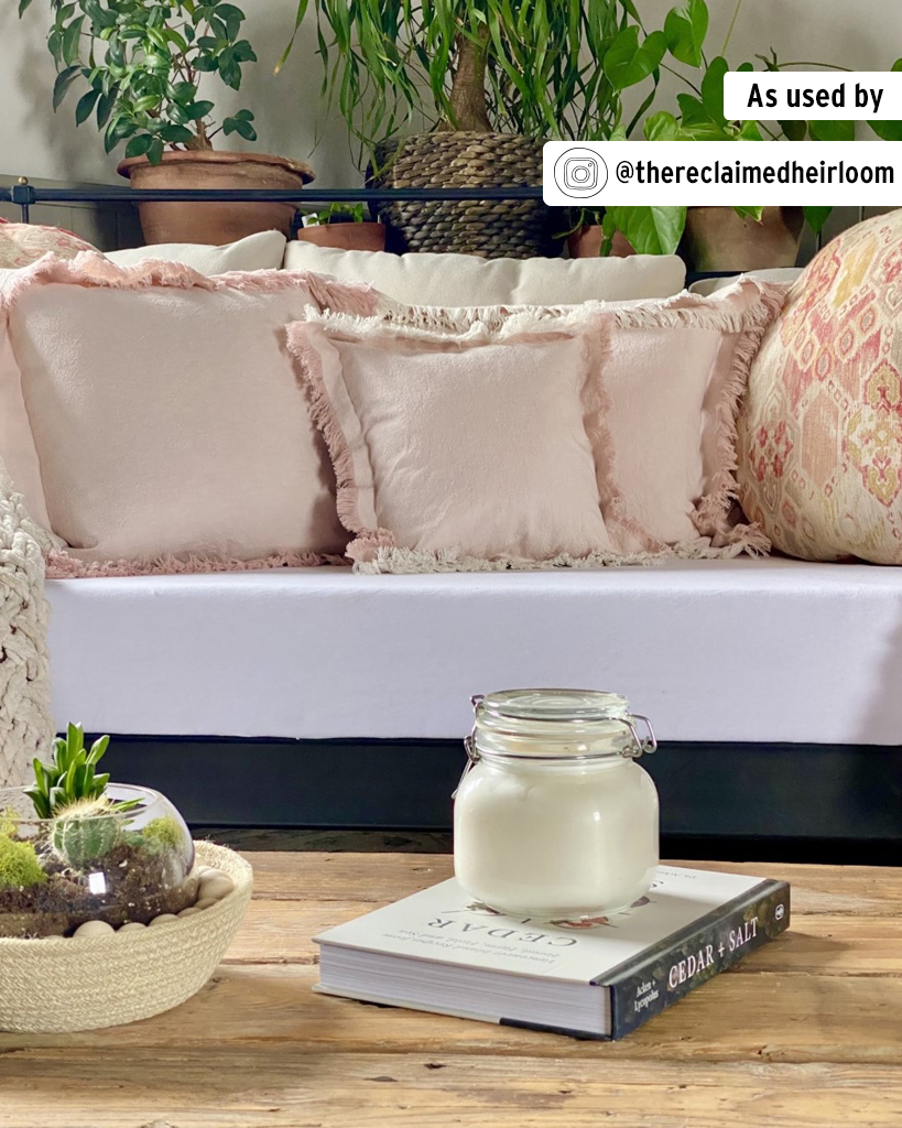 Annie Sloan Antoinette Old White Linen Union Fabric Cushions on Sofa featuring Candle in Foreground