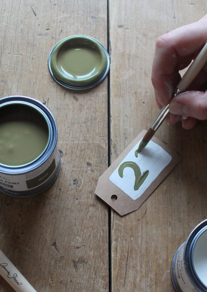 Painting Numbers on Brown Tags using Olive Chalk Paint