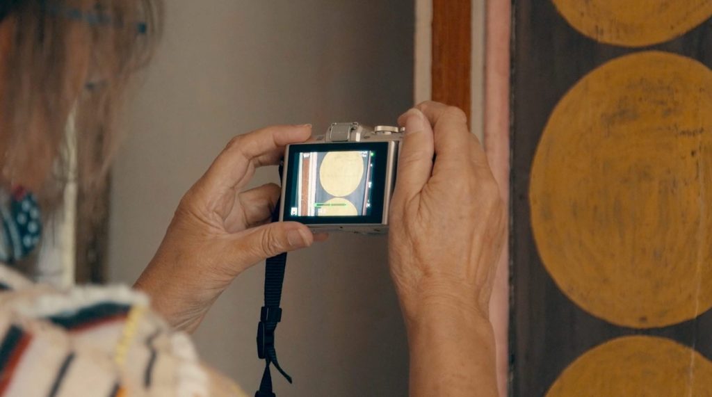 Annie Sloan at Charleston Farmhouse photographing a wardrobe