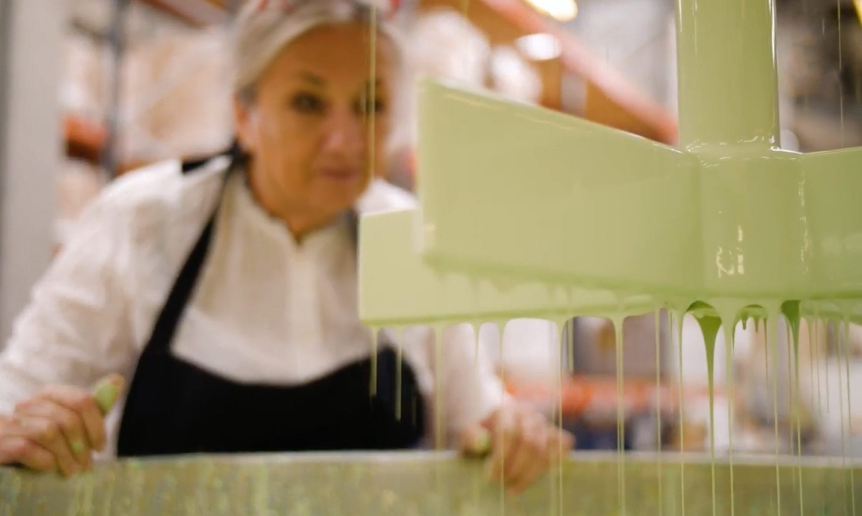 Annie Sloan at a vat of Chalk Paint in Lem Lem in Oxford HQ factory