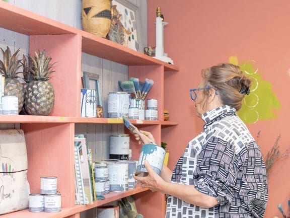 Annie Sloan painting her display at Heal's Spaces Exhibition, September 2018