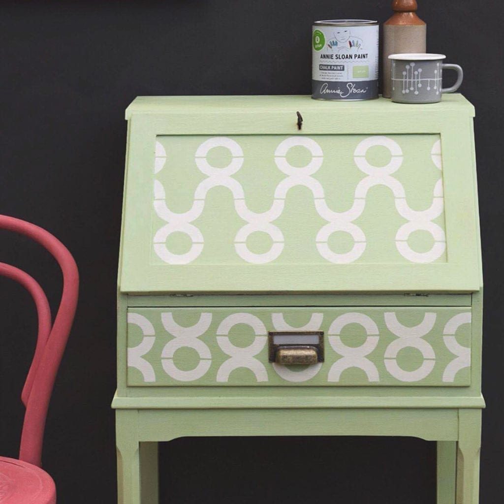 Jonathon Marc Mendes' writing desk bureau painted with Chalk Paint® by Annie Sloan in Lem Lem with Oxfam symbols