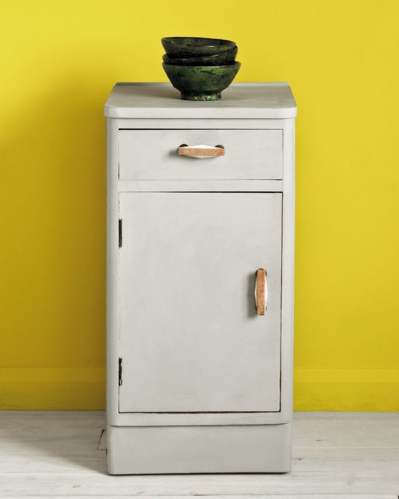 Side table painted with Chalk Paint® in Paris Grey, a soft and slightly bluish grey against English Yellow Wall Paint