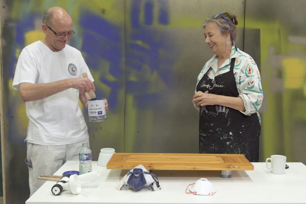Annie Sloan and Ron Taylor show how to paint a kitchen cabinet using a spray gun with Chalk Paint® in Napoleonic Blue
