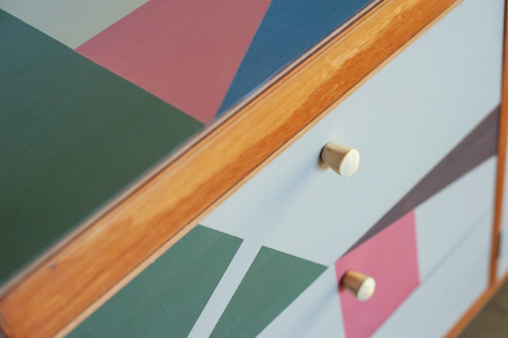 Mid-century modern sideboard painted with Chalk Paint® by Annie Sloan Painter in Residence Polly Coulson with geometric shapes