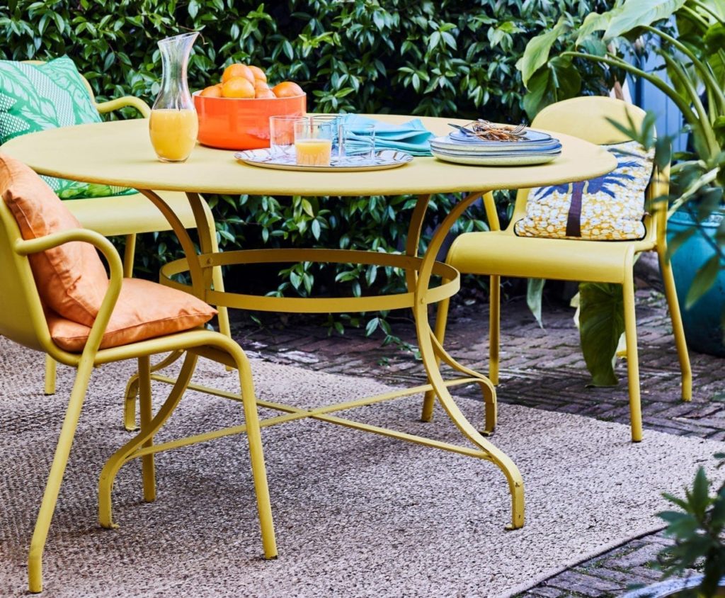 Outdoor dining furniture painted with Chalk Paint® furniture paint by Annie Sloan in English Yellow and Matt Lacquer