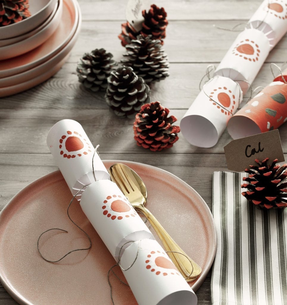 Scandinavian style Christmas dining room - stencilled crackers and painted pine cone place name holders in Chalk Paint® by Annie Sloan