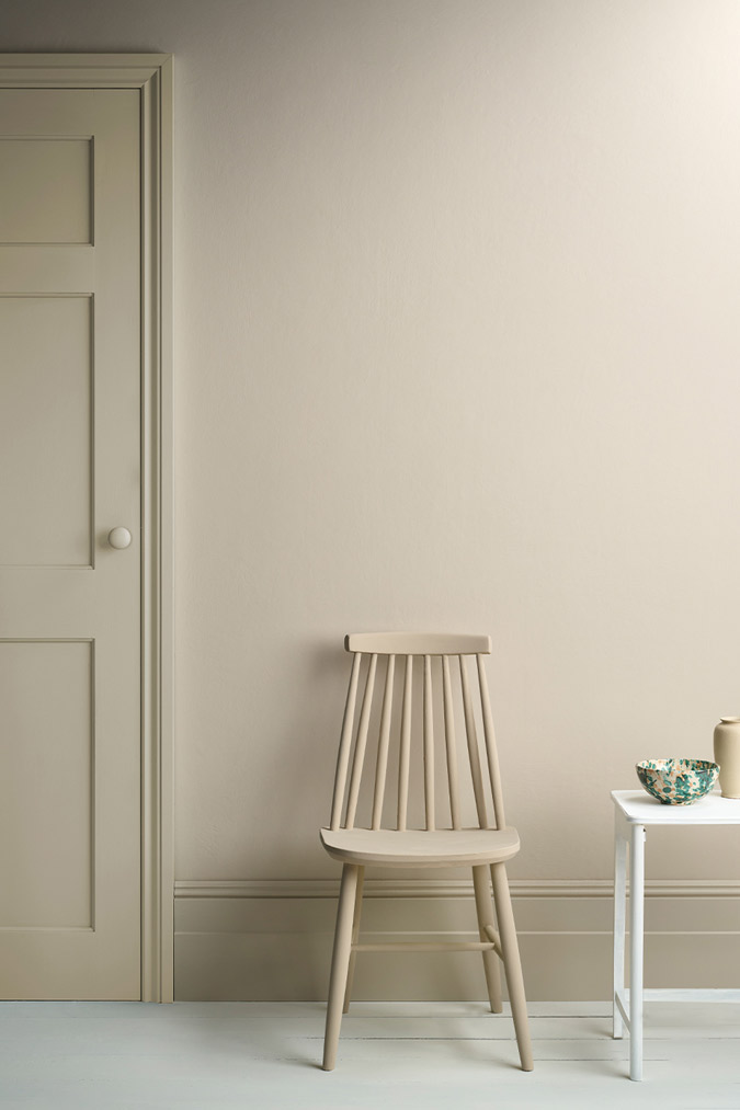 Lifestyle Image of Annie Sloan Satin Paint in Canvas featuring painted door and skirting
