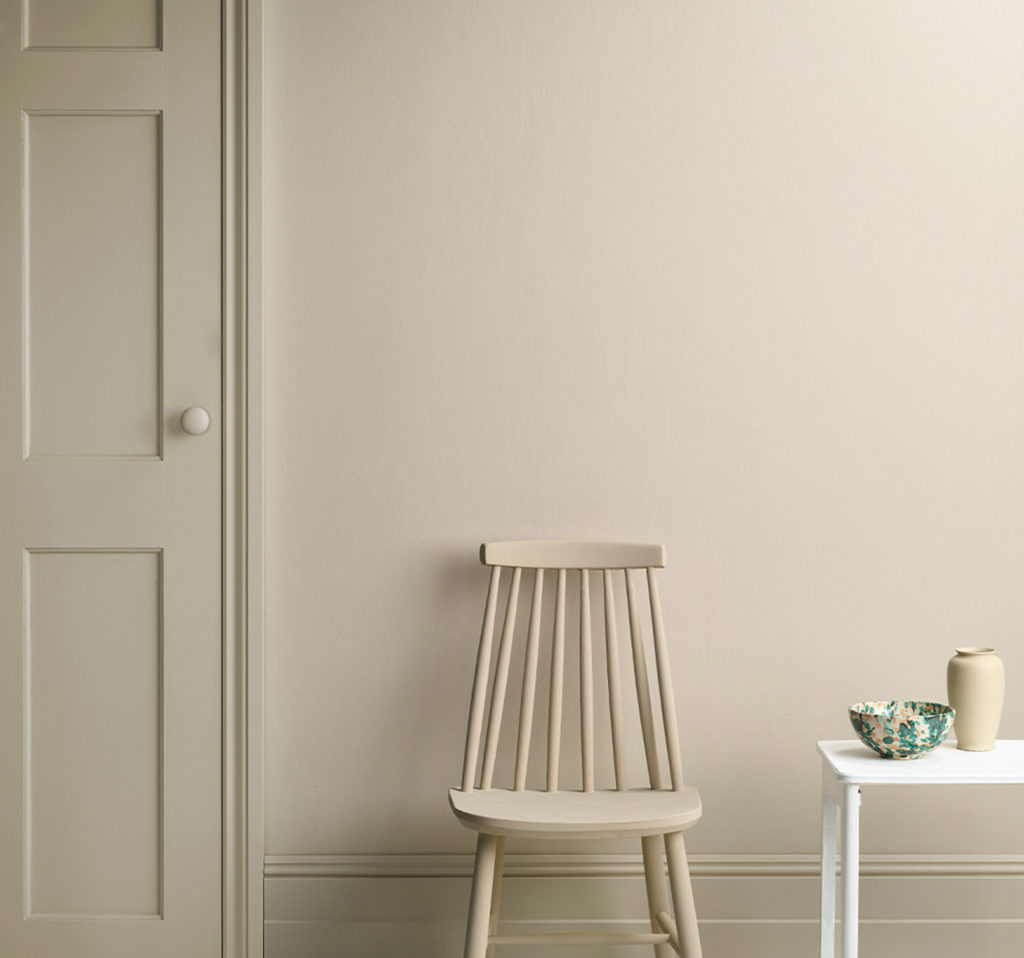 Lifestyle Image of Annie Sloan Satin Paint in Canvas featuring painted door and skirting