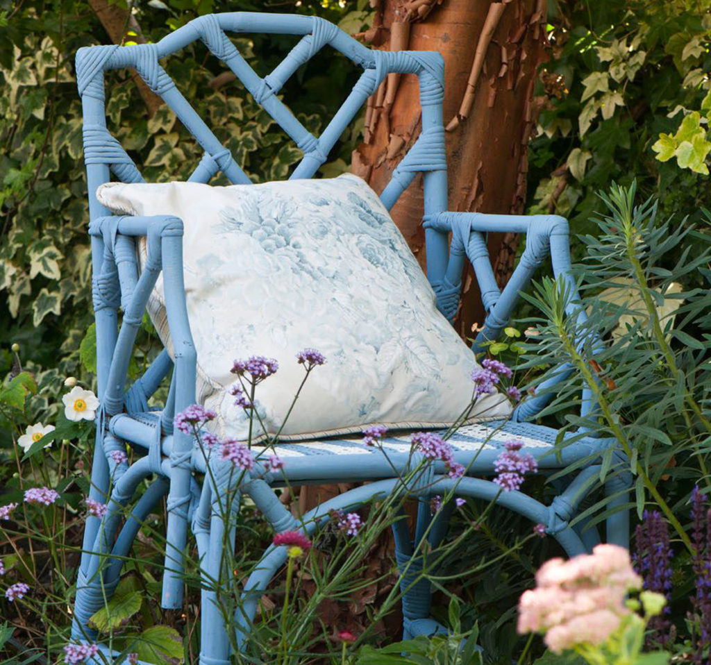 Annie Sloan Chalk Paint Chair in Greek Blue and Old White Outside Surrounded by Flowers