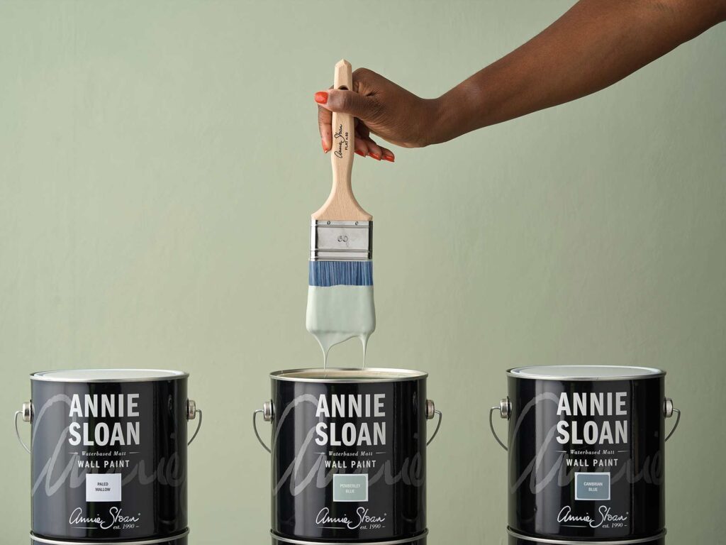 flat brush dipped in wall paint Annie Sloan