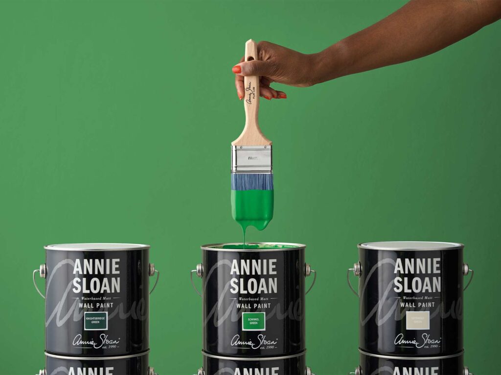 flat brush dipped in Annie Sloan wall paint