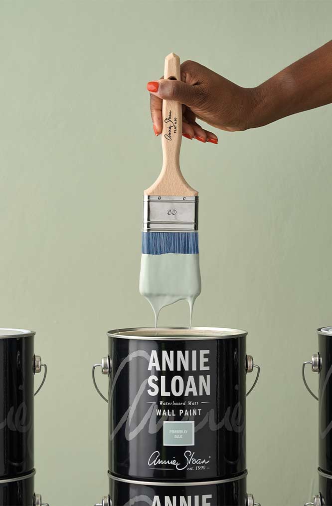 flat brush dipped in wall paint Annie Sloan