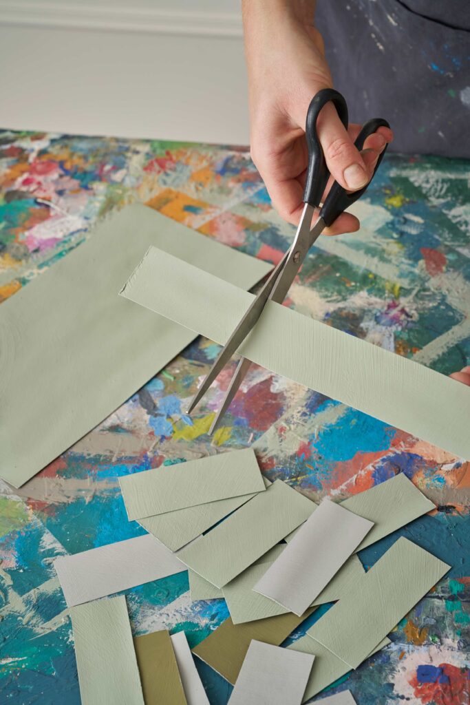 cutting the painted card into rectangles.