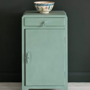 Side table painted with Chalk Paint® in Duck Egg Blue, a greenish soft blue against a black wall of Graphite