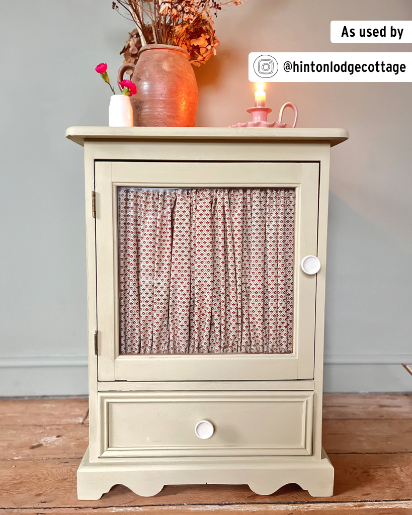 Cottage-Style Side Table with Curtained Glass Panel Painted in Versailles Chalk Paint and Staged with Decorative Vases and Candle