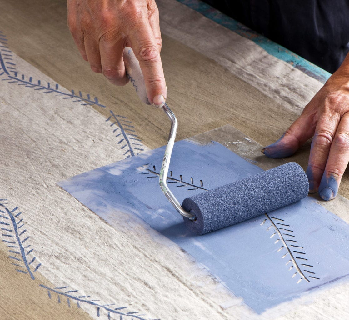 Annie Sloan stencilling dyed fabric using Chalk Paint in Old Violet and a sponge roller