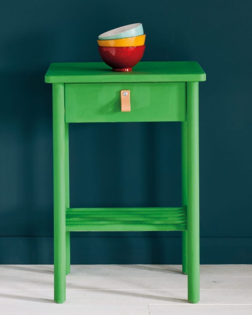Side table painted with Chalk Paint® in Antibes Green, a bright neoclassical green against a wall of Aubusson Blue