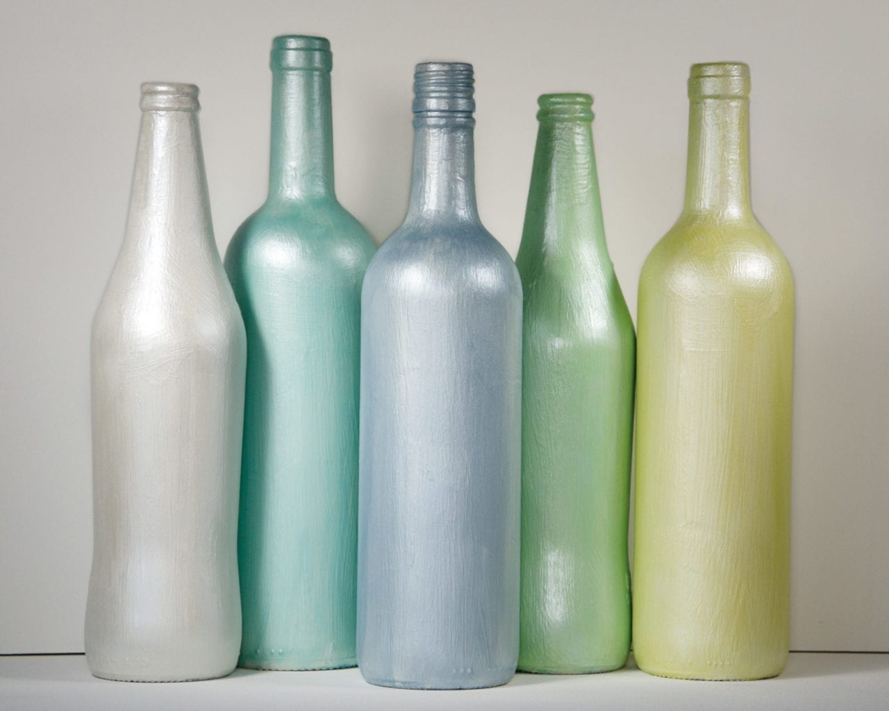 Pearlescent iridescent bottles painted with Chalk Paint® and Pearlescent Glaze by Annie Sloan