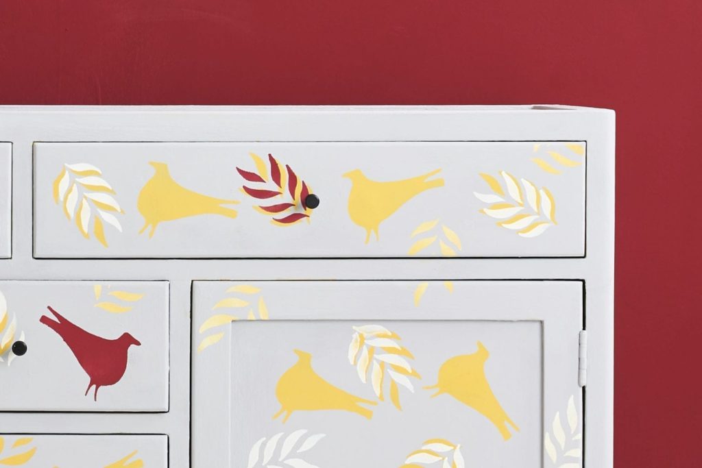 Stencilled cabinet from The Colourist Issue Two painted with Chalk Paint® in Chicago Grey, Burgundy and Tilton