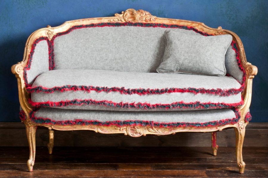 Linen Union fringed upholstered ornate French sofa painted with Chalk Paint® furniture paint and gilded with Brass Leaf