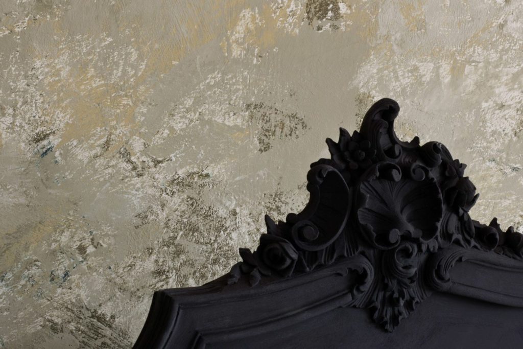 Baroque style bed painted with Chalk Paint® furniture paint by Annie Sloan in Athenian Black, textured neutral wall