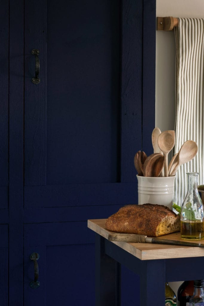 Kitchen cabinets and trolly painted with Chalk Paint® furniture paint by Annie Sloan in Oxford Navy, floor painted with Versailles