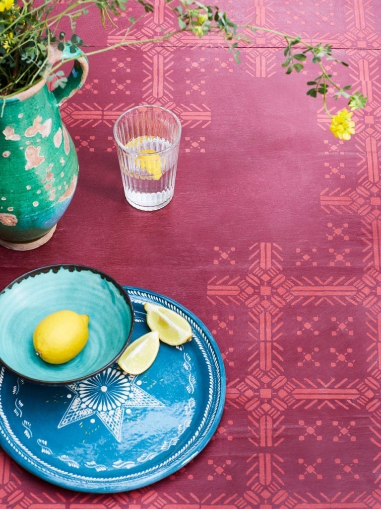 Table painted with Chalk Paint® by Annie Sloan in Burgundy and stencilled with Tallulah in Emperor's Silk