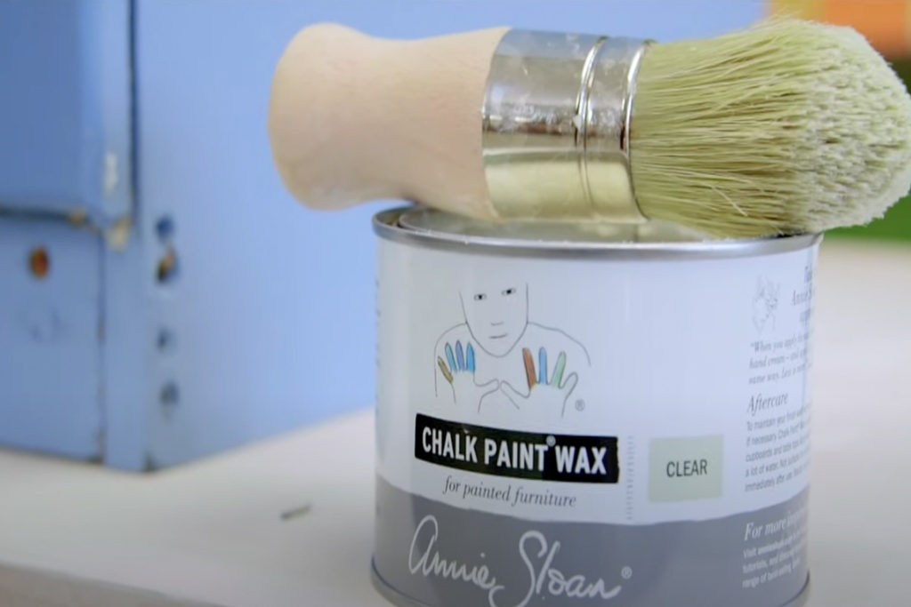 Close up of Annie Sloan Chalk Paint® Wax tin and brush