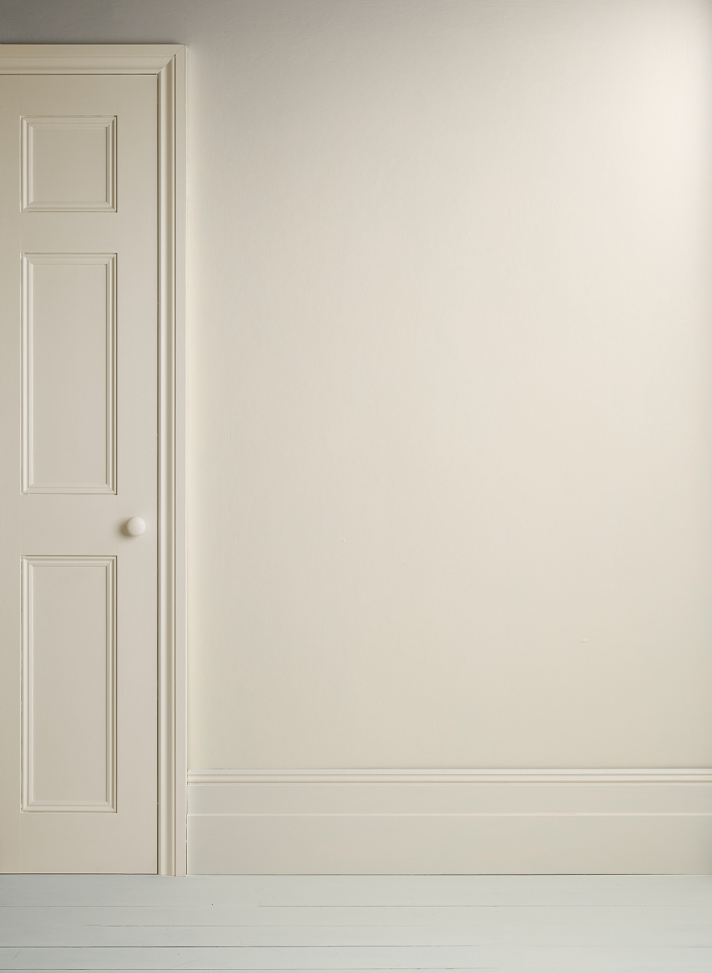 Lifestyle Image of Annie Sloan Satin Paint in Original used on door and skirting