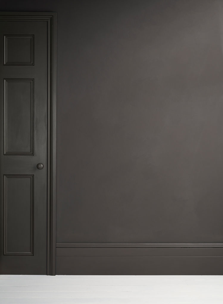 Lifestyle Image of Annie Sloan Satin Paint in Graphite used on door and skirting